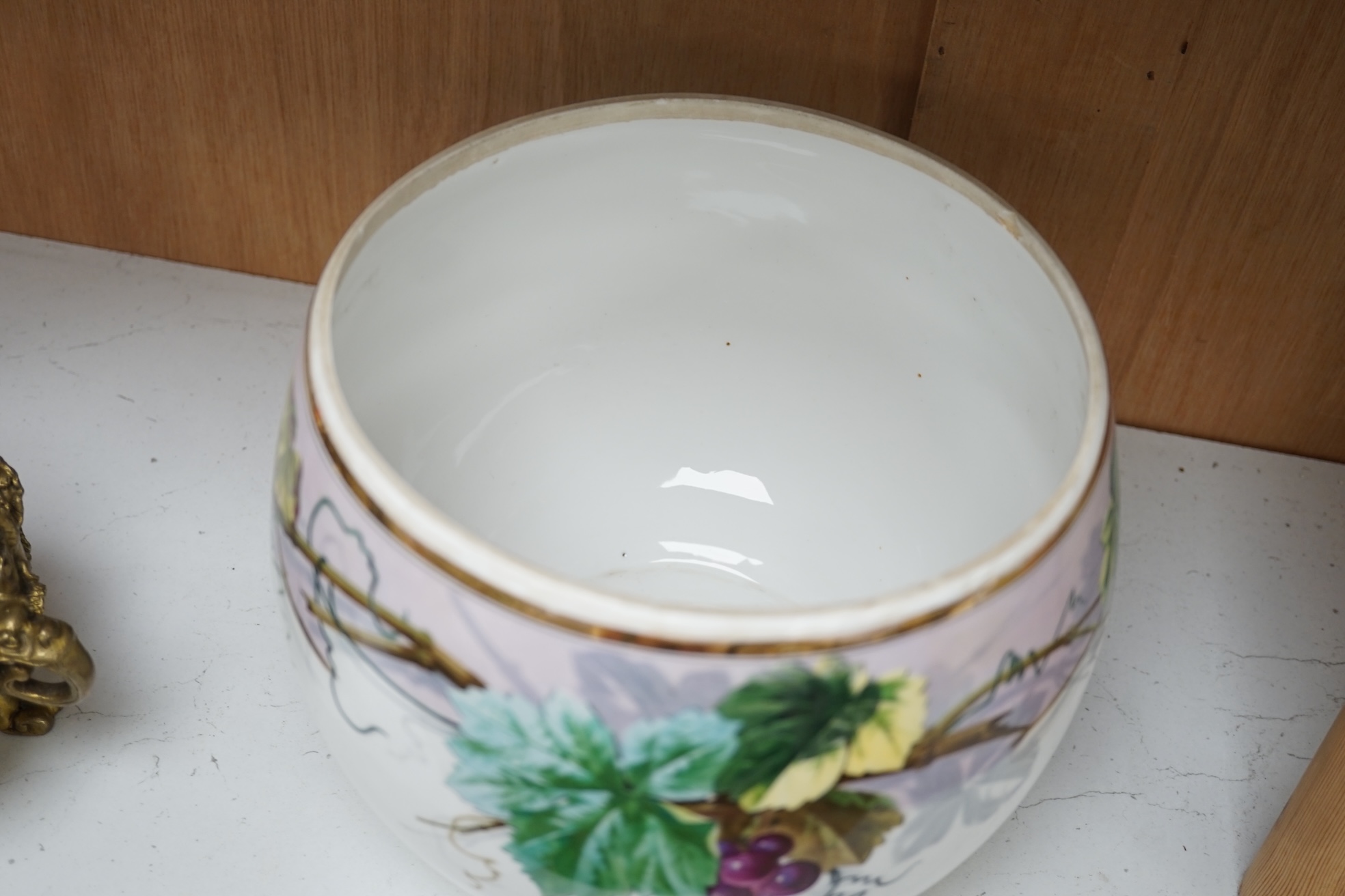 A Paris porcelain grape and vine painted punch bowl and cover, 27cm high. Condition - fair to good.